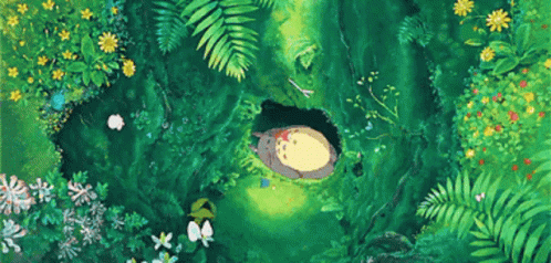 Sleeping Totoro In Forest Hole Surrounded By Flowers GIF