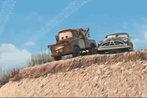 A Tow Truck Is Pulling A Car Down A Dirt Hill GIF