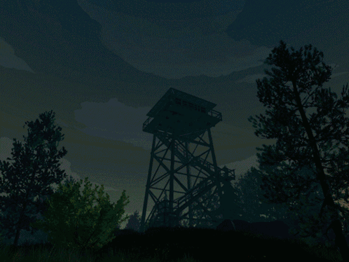 A Tower In The Middle Of A Field With A Blue Sky In The Background GIF