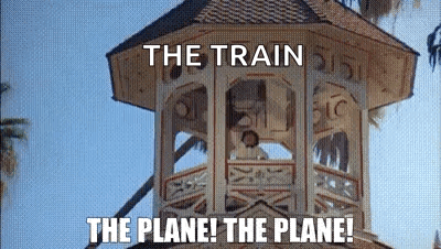A Tower With The Words `` The Train The Plane ! The Plane ! '' Written On It . GIF