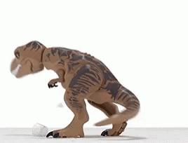 A Toy Dinosaur Is Standing On A White Surface With Its Mouth Open And A Plastic Bottle In Its Mouth . GIF