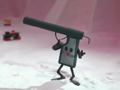 A Toy Gun With A Microphone Attached To It Is Walking In The Snow . GIF