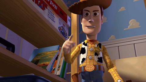 A Toy Story Character Is Standing In Front Of A Bookshelf GIF