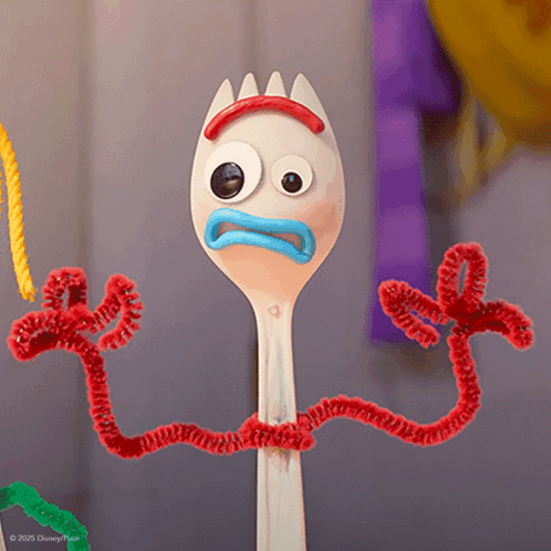 a toy story character made out of a fork and pipe cleaners