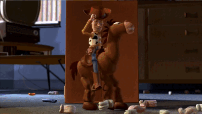 A Toy Story Character Riding A Brown Horse GIF