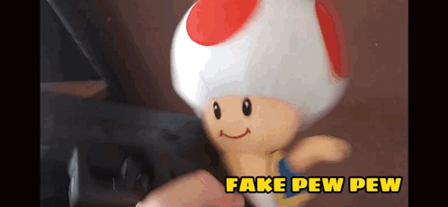 A Toy Toad With Fake Pew Pew Written On The Bottom Right GIF