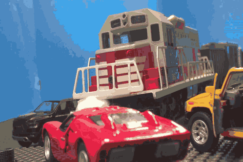 A Toy Train Has The Number 13E On The Side GIF