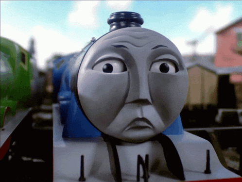 A Toy Train With A Sad Look On Its Face And The Number 1 On The Front GIF