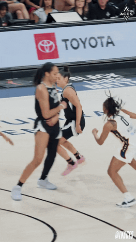A Toyota Ad Is Behind A Basketball Game GIF