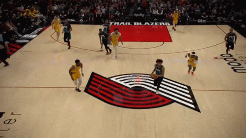 A Trail Blazers Basketball Game Is Being Played On A Basketball Court GIF