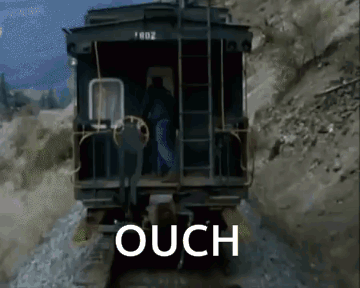 A Train Is Going Down The Tracks And The Word Ouch Is On The Screen GIF
