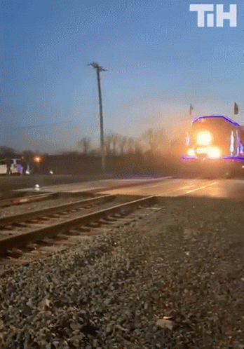 A Train With Decorative Lights GIF