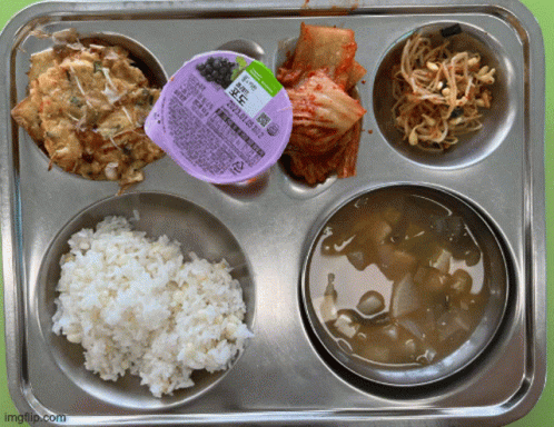 A Tray Of Food With A Purple Container That Says ' Imgflip.com ' On The Bottom GIF