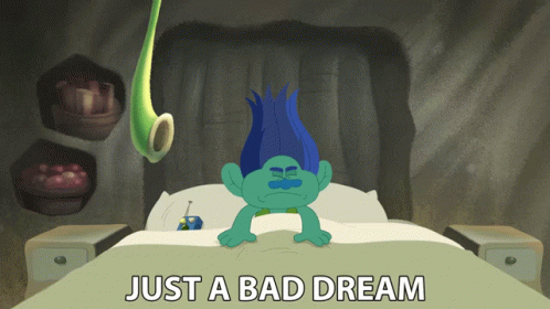 A Troll Laying On A Bed With The Words Just A Bad Dream Above Him GIF