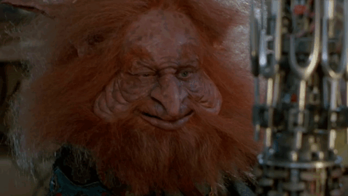 A Troll With A Beard Is Holding A Machine Gun GIF