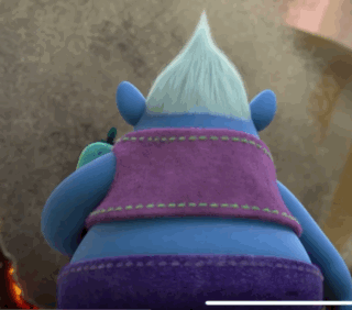A Troll With A Purple Vest And Purple Shorts GIF