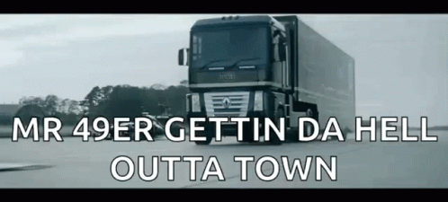 A Truck Is Driving Down A Road With The Words Mr 49Er Gettin Da Hell Outta Town Below It . GIF