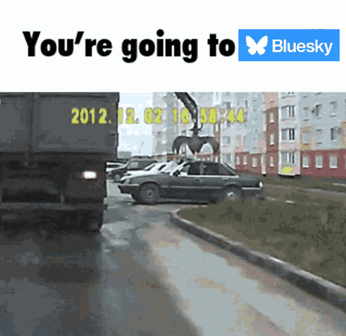 a truck with the year 2012 on the back is driving down a street