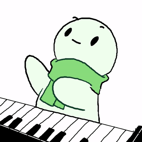 A Turtle Is Sitting On A Piano Keyboard With A Green Scarf Around Its Neck GIF
