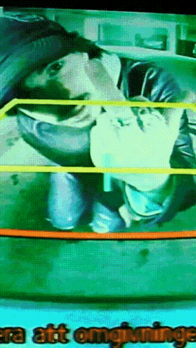 A Tv Screen Shows A Man In A Wrestling Ring And The Words " Era Att Omgivningen " GIF