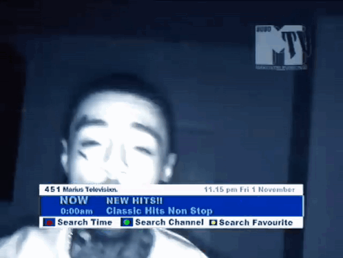 A Tv Screen Shows A Young Boy And Says " New Hits " On It GIF