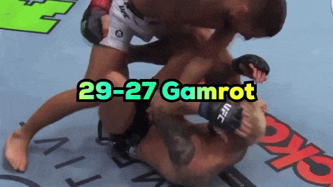 A Ufc Fighter Is Being Pinned By Another Fighter GIF