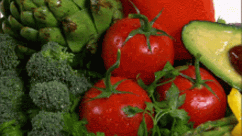 A Variety Of Fresh Vegetables Including Broccoli Tomatoes Avocado And Artichokes GIF