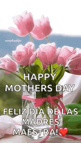 A Vase Filled With Pink Flowers And The Words `` Happy Mothers Day Feliz Dia De Las Madres Maestra '' GIF