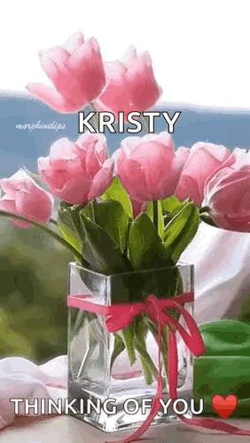 A Vase Filled With Pink Flowers With The Name Kristy On It . GIF