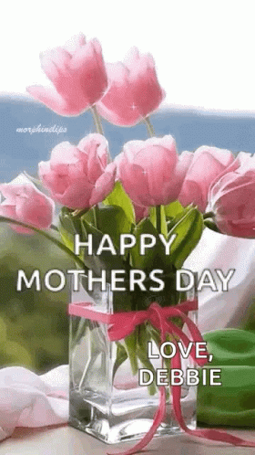 A Vase Filled With Pink Flowers With The Words `` Happy Mother 'S Day Love , Debbie '' Written On It . GIF