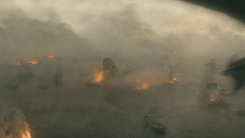 a very foggy scene with ships on fire in the water