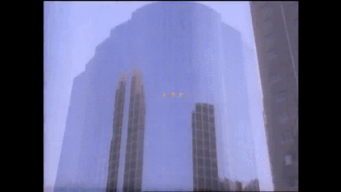A Very Tall Building With The Letters I.t.p. Visible GIF