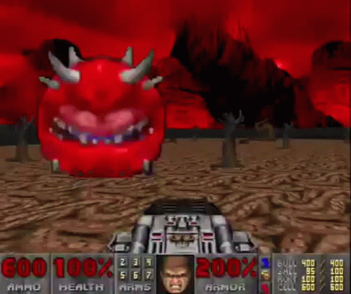 A Video Game Called Doom Has A Red Monster With Horns And A Face On It GIF