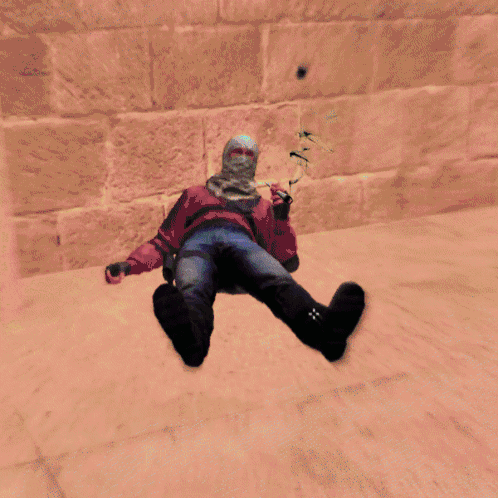A Video Game Character Is Laying On The Floor In A Green Room GIF
