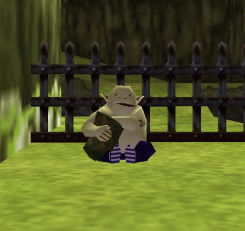 a video game character is sitting in front of a fence holding a rock