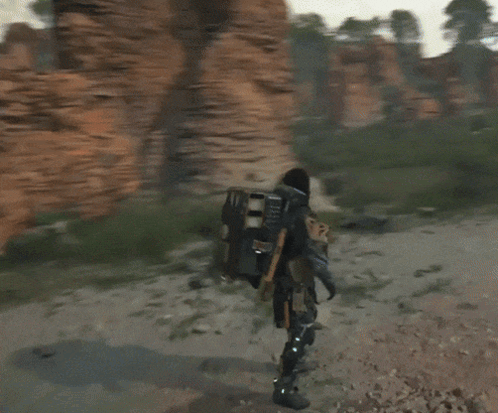A Video Game Character Is Standing In Front Of A Person GIF
