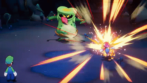 A Video Game Character , Luigi , Is Fighting A Monster In A Dark Cave . GIF