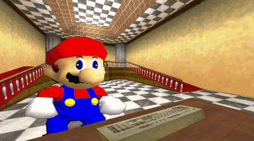 A Video Game Character Named Mario Is Sitting At A Desk In Front Of A Keyboard GIF