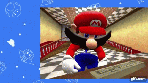 A Video Game Character Named Mario Is Sitting At A Desk With A Keyboard GIF