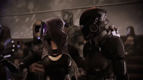 A Video Game Character With A Helmet That Says N7 GIF