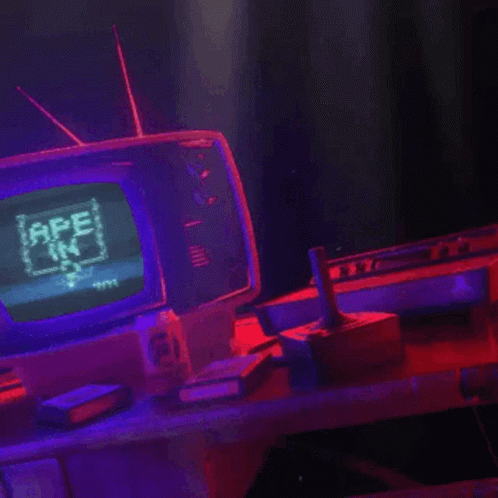A Video Game Controller Is Sitting On A Table Next To A Television GIF