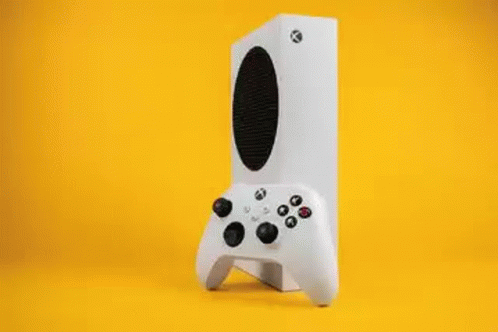 A Video Game Controller Is Sitting On A Table Next To A Video Game Box . GIF