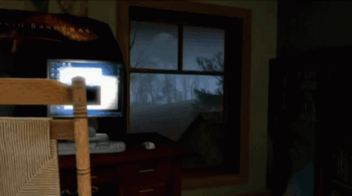 A Video Game Is Being Played In A Room With A Sign That Says Roots On It GIF