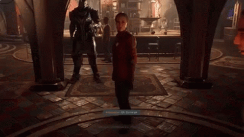 A Video Game Screen Shows A Man Standing Next To A Giant Robot GIF
