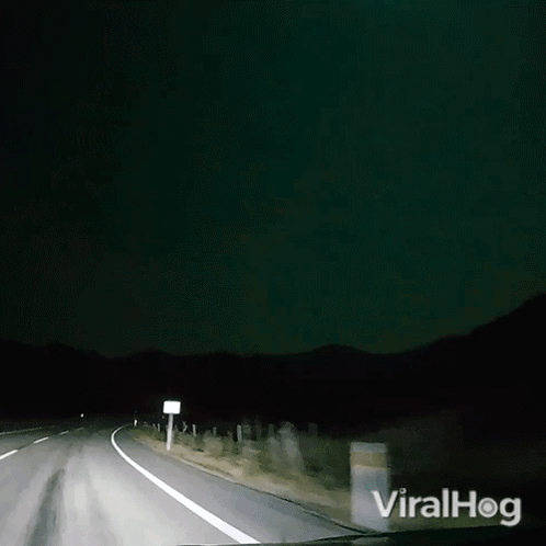 A Video Of A Car Driving Down A Road With The Words Viralhog On The Bottom Right GIF