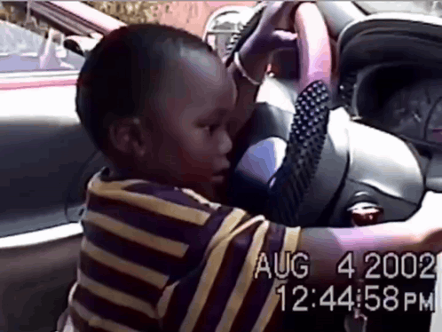 A Video Of A Child Driving A Car Was Taken On Aug 4 2002 At 12:34:58 Pm GIF