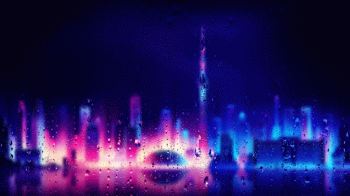 A View Of A City Skyline Through A Window With Rain Drops On It GIF
