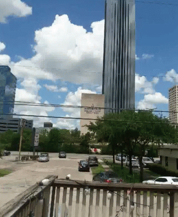 A View Of A City With A Building That Says ' Bank Of America ' On It GIF
