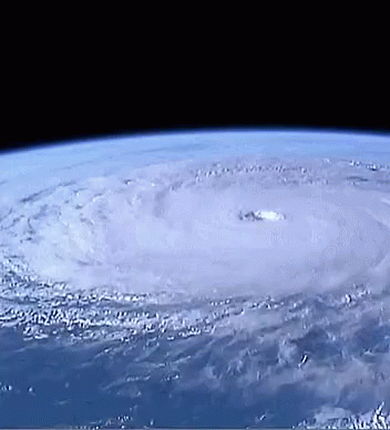 A View Of A Hurricane From Space With A Hole In The Center GIF