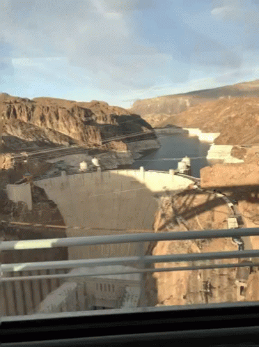 A View Of A Large Body Of Water From A Bridge GIF